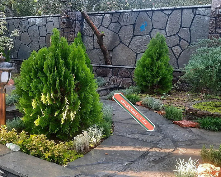 نمای دیوارهای باغ با سنگ طوسی اجرای کلی و تعمیر بناهای قدیمی برای اطلاعات بیشتر