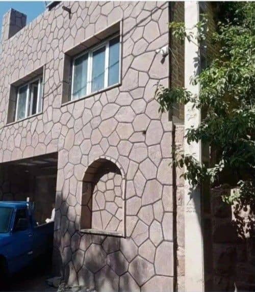 اجرای سنگ لاشه موج دار برای نمای ویلا دیوار ساختمان باغ پیمانکار سنگ ورقه ای نادری در ایران 